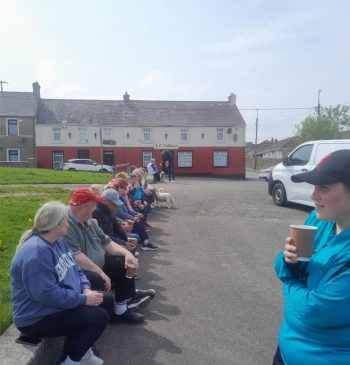 Walking group photo tea on wall